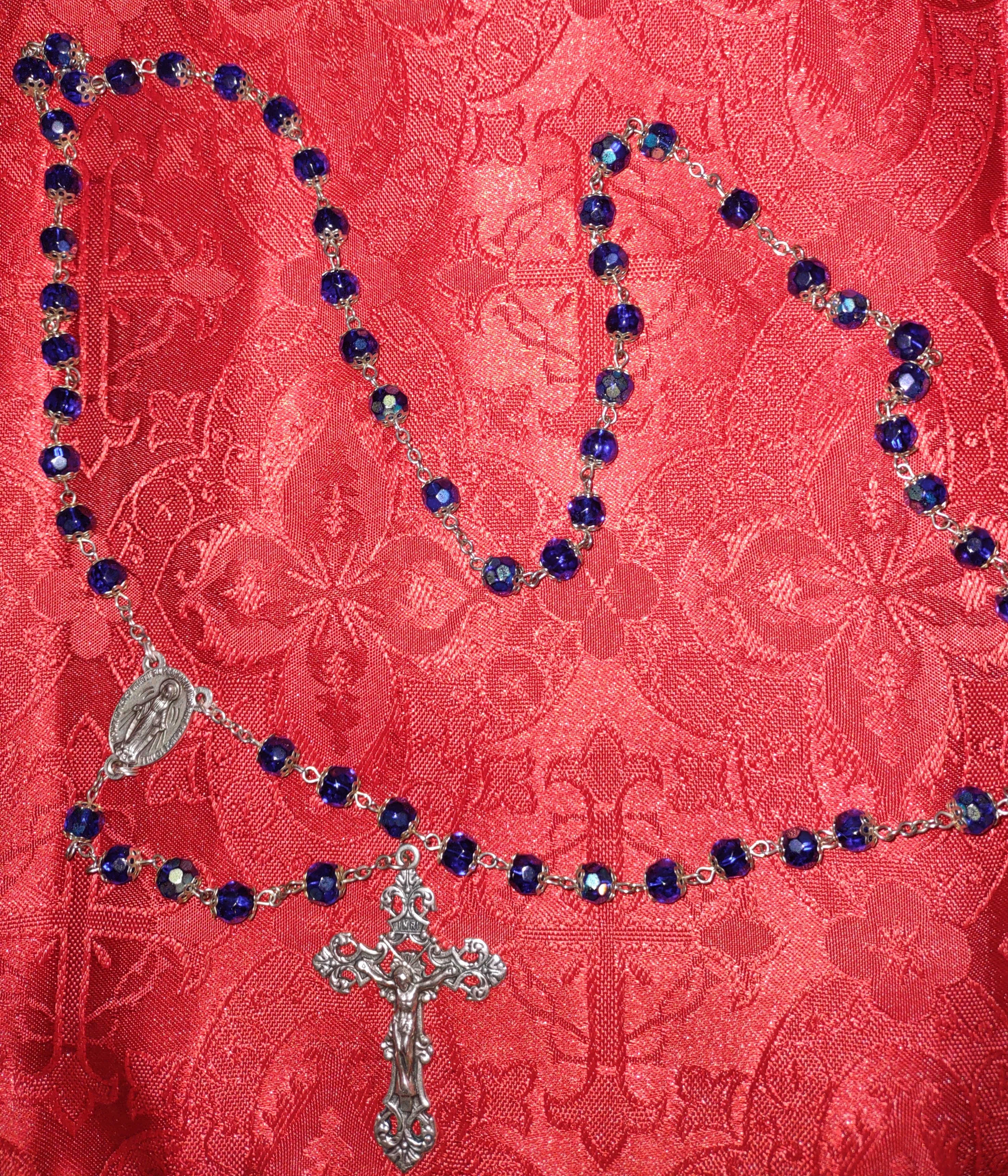 bluerosaryredbackdrop bluerosaryredbackdrop